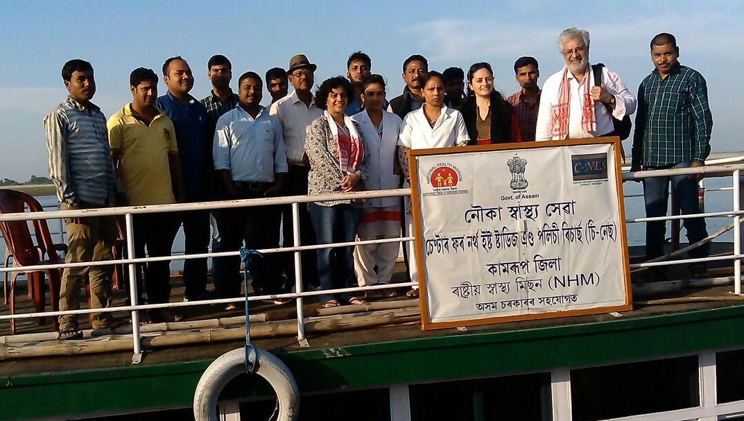 The visitors on the deck of the Kamrup Boat Clinic with the health team