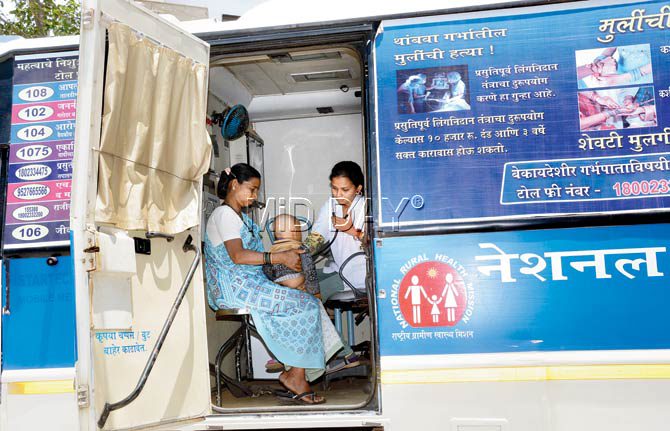 Dr Bhakti Sathe checking on a patient at the National Mobile Medical Unit van in Jawhar. The mobile unit outreach by Dr Patil by NRHM comes with a team strength of 12. Private stakeholders like the Hinduja group provide her a van with a team of five. When on her own, Patil has one assistant with her own vehicle