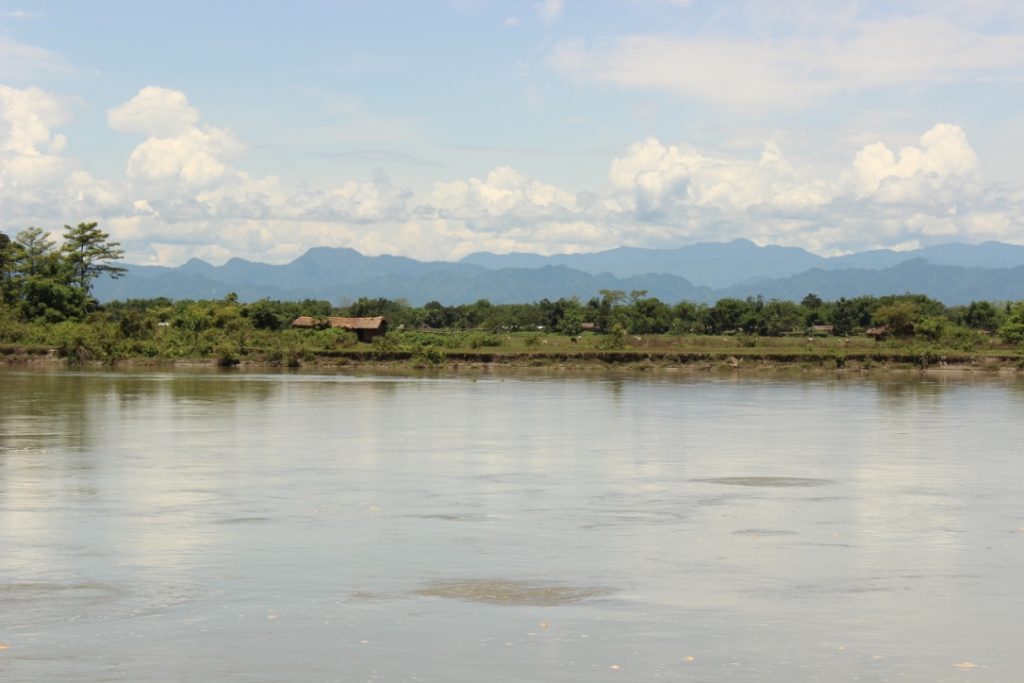 The mighty Brahmaputra, framed by the majestic Himalayan ranges of Arunachal Pradesh in the background as we sail along the sand bars in Assam’s Dibrugarh District