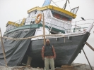 Akha under repair with its Master, Kapilash , in the foreground at Maijan Ghat, Dibrugarh, Nov 2009