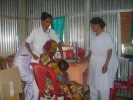 A mother and child undergoing check up at the newly initiated Barpeta camp on 18 march 2009 . Women and child are the main focus of the Boat Clinic programme.