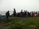 The UNICEF documentary team at the Aichung sapori health camp under an overcast sky.