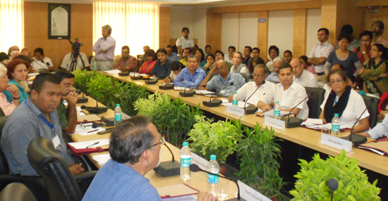 Prof. Udayon Misra deliberating on the background and core issues, participants are attentively listening