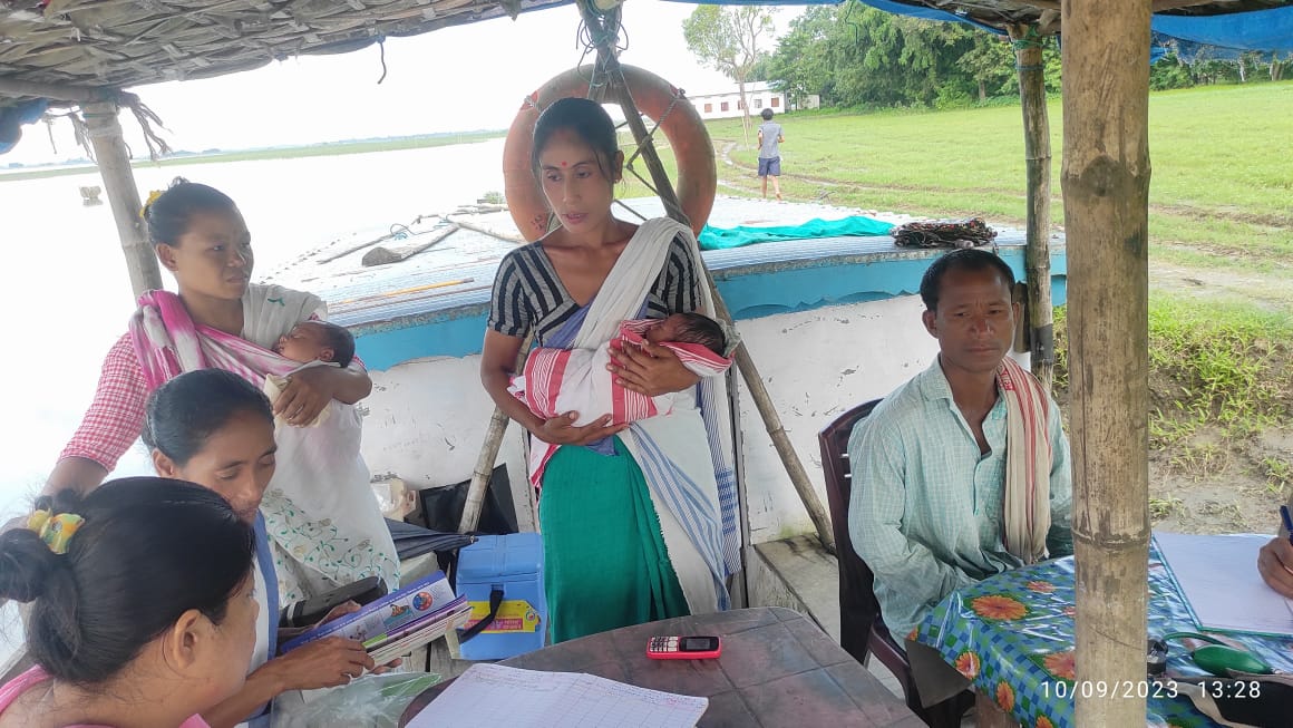 Young mothers with infants gather at a health camp at Pabobhekeli island conducted by Lakhimpur Boat Clinic- October 2023